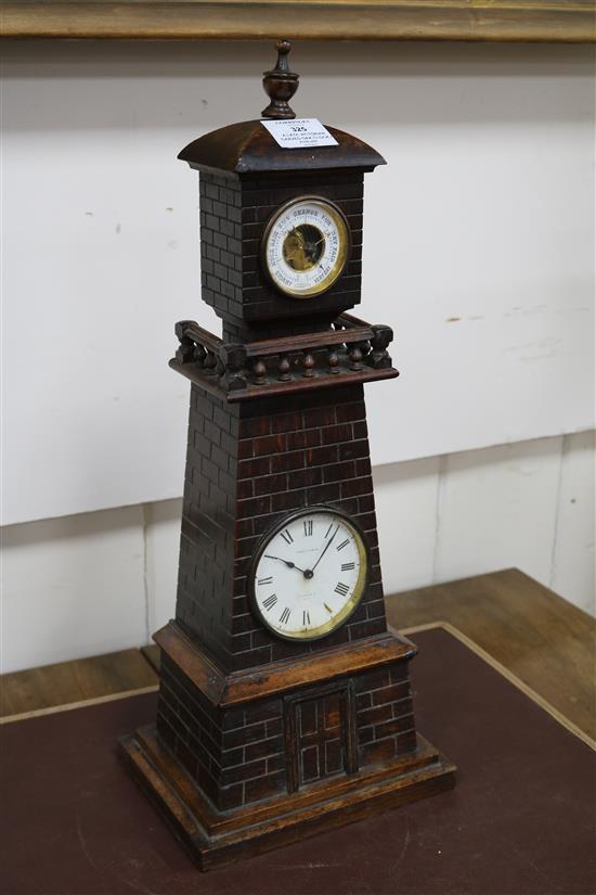 A late Victorian carved oak Lighthouse  clock barometer by Frank Flower of St James